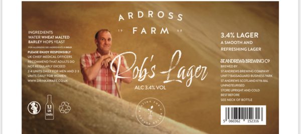 Lager label with picture of a man holding a shovel in his hand standing in a pile of barley.